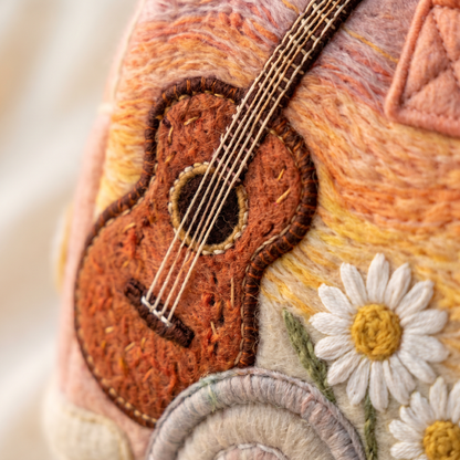 Hippie Bus Weekender — Sunset Strummer — macro detail of embroidered acoustic guitar